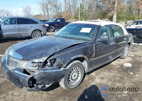 2000 Lincoln Town Car Executive из США, поврежденный, VIN 1LNHM81W7YY797025